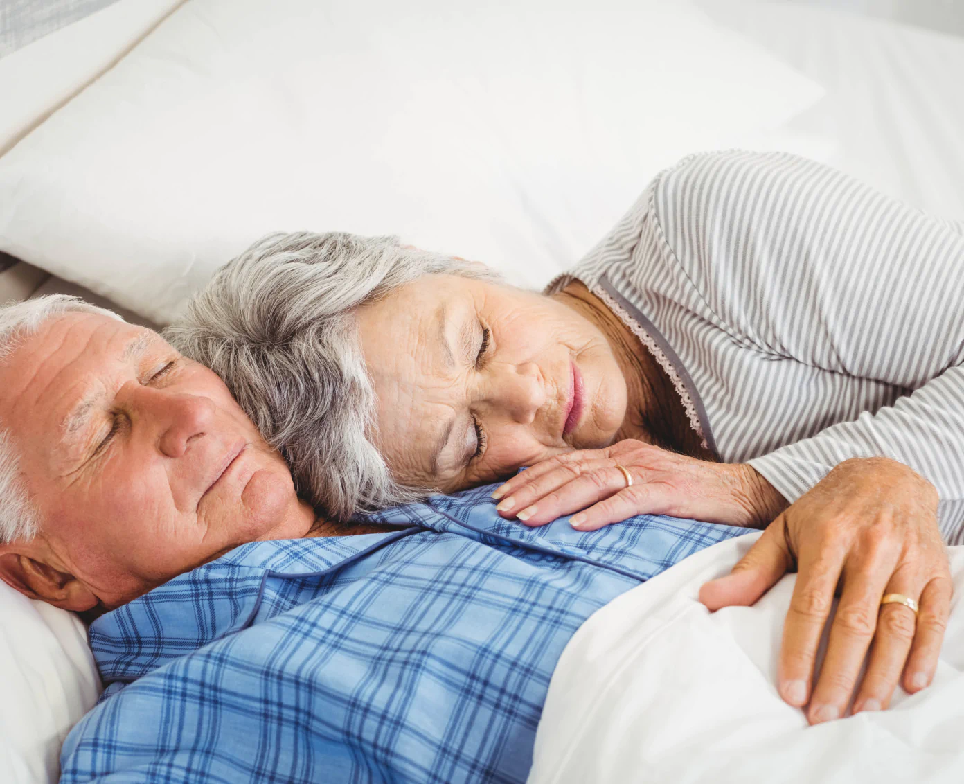 sleeping senior couple