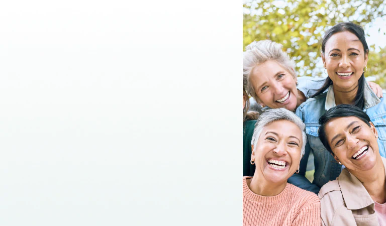 A group of happy, healthy women enjoying time together outdoors, representing vitality supported by supplements for women's health.
