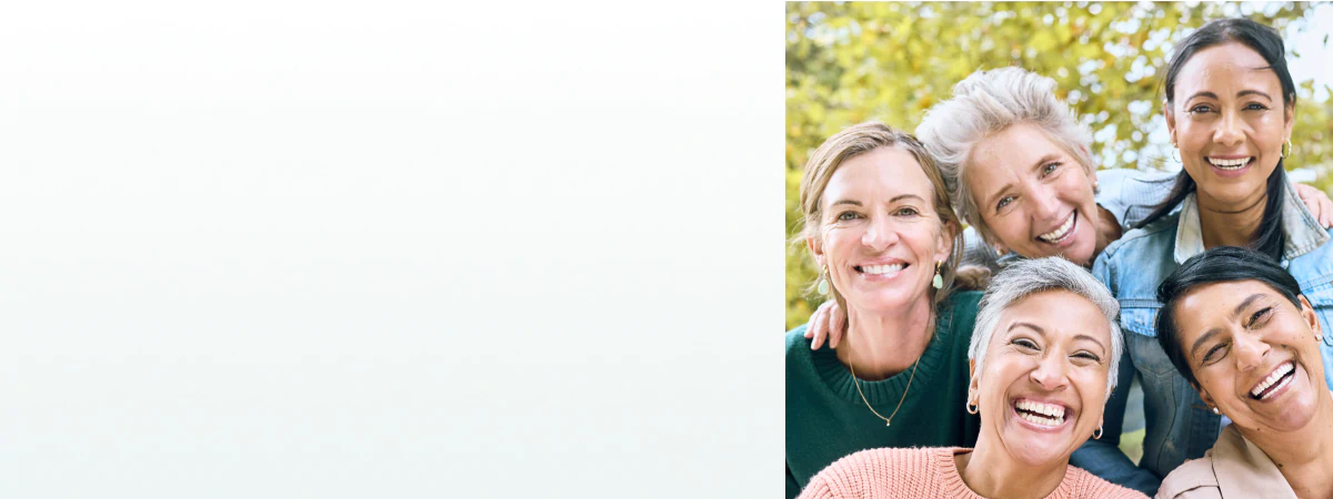 A group of happy, healthy women enjoying time together outdoors, representing vitality supported by supplements for women's health.