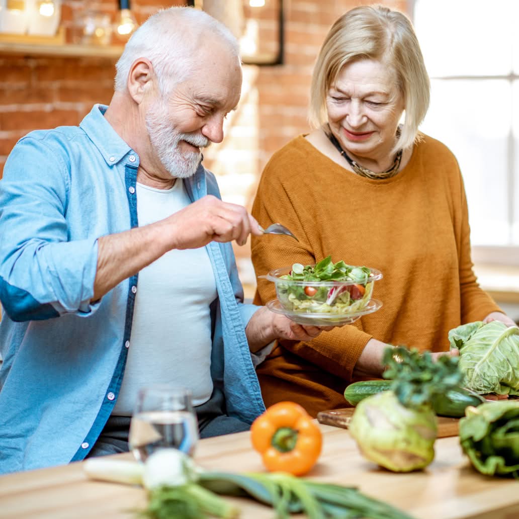 Couple making a salad